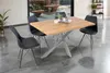 A dining table with chairs in a modern setting. Produktbild-Vorschau
