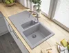 A kitchen sink with a faucet on a wooden countertop, with blinds in the background. Anteprima dell’immagine prodotto
