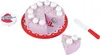 A toy cake with slices, candles, and a knife, along with a decorative lid featuring an elephant. Voir les images du produit