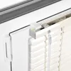 A close-up view of a window blind mechanism, showing the mounting bracket and part of the blind itself. Produktbild-Vorschau