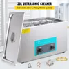 A VEVOR ultrasonic cleaner is shown with a lid open, revealing items being cleaned in water. Several pieces of jewelry are displayed in the foreground. Podgląd zdjęcia produktu