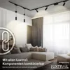 A living room with a sectional sofa, track lighting, and curtains. Anteprima dell’immagine prodotto