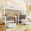 A child's bedroom with a white bunk bed setup that includes a desk and seating area. Voir les images du produit