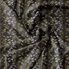 A close-up view of dark gray fabric with a gold floral pattern. Náhľad obrázku produktu