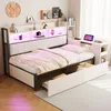 A bedroom scene featuring a bed with integrated desk and storage, illuminated by LED lights. Podgląd zdjęcia produktu