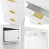A collage of four close-up images showing details of a white dresser or vanity with gold handles and decorative leaf patterns. Produktbild-Vorschau