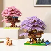 Two decorative treehouse models with pink and purple foliage, displayed on a table. Anteprima dell’immagine prodotto