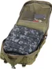 An open green military-style backpack with a folded camouflage sleeping bag inside and some small items in a mesh pocket at the top. Voir les images du produit
