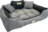 A dog bed with pillows and a brand logo. Voir les images du produit