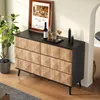 A sideboard with a framed picture, drinks, and candles on top, placed in a room with wooden flooring. Produktbild-Vorschau
