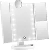 A white tri-fold makeup mirror with LED lights and a small magnifying mirror attached to the top center. Produktbild-Vorschau