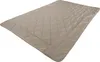 A beige quilted blanket laid out on a white background. Produktbild-Vorschau