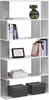 A white and concrete-look bookshelf filled with books and decorative items. Produktbild-Vorschau