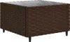 A brown rattan coffee table with a glass top and black legs, shown from a slightly elevated angle against a white background. Náhľad obrázku produktu