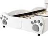 A close-up side view of a white bed frame with paw print decorations. Produktbild-Vorschau