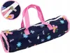 A cylindrical bag with a floral pattern and pink handles, shown against a white background. A close-up inset shows the zipper detail. Produktbild-Vorschau