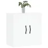 A white cabinet with two doors and black handles, topped with a vase of green leaves. Podgląd zdjęcia produktu