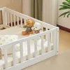 A close-up view of a white wooden children's bed with two teddy bears and a pillow inside. Náhľad obrázku produktu