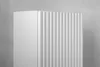 A close-up of a white cabinet with vertical fluting on one side, set against a gray background. Podgląd zdjęcia produktu