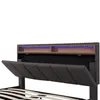 A close-up view of a modern upholstered bed frame's headboard, showing storage compartments and LED lighting. Podgląd zdjęcia produktu