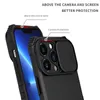 A close-up view of a black iPhone case, highlighting its camera protection feature and raised edges for screen protection. Produktbild-Vorschau