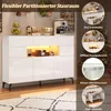 A white high-gloss sideboard with LED lighting, displayed in a room setting with decorative items and a Christmas tree in the background. Several circular insets highlight different features of the sideboard. Voir les images du produit