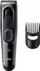 A black electric hair clipper and a black comb attachment are shown on a white background. Náhľad obrázku produktu
