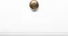 A close-up of a brass tack on a white surface. Anteprima dell’immagine prodotto