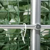 A close-up view of a green leaf privacy screen attached to a silver pole with a white zip tie. Anteprima dell’immagine prodotto