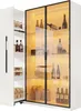A white cabinet with glass doors displaying bottles and jars, illuminated by warm yellow LED lights. Produktbild-Vorschau