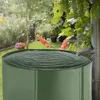 A green rain barrel filled with water in a garden setting, with a downspout directing water into it. Náhled obrázku produktu