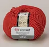 A ball of reddish-orange yarn with a label attached. Voir les images du produit