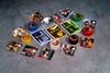 Board game components laid out on a textured gray surface. Produktbild-Vorschau