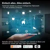 A hand holding a smartphone displaying a smart home network diagram with various connected devices, set against a blurred bedroom background. Produktbild-Vorschau