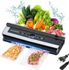 A vacuum sealer appliance with various fresh food items, including vegetables and raw meat, displayed above it, with two vacuum-sealed bags (one with diced vegetables and another with a steak) in front of the appliance. Podgląd zdjęcia produktu