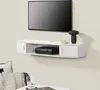 A white floating TV shelf mounted on a light gray wall, with a black TV and a black decorative object on top. Anteprima dell’immagine prodotto