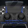 Close-up of a black game controller with a protective film on top, featuring text overlays describing its features. Produktbild-Vorschau