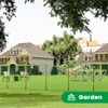 A backyard scene with houses, trees, and a fence. Produktbild-Vorschau