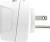 A white travel adapter with US prongs is shown from the side against a white background. The word TRAVELIGHT is visible as a watermark. Produktbild-Vorschau