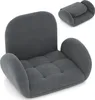 A gray floor chair is shown from a slightly elevated angle, with a smaller, folded version of the chair in the upper right corner. Produktbild-Vorschau