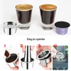 The image shows two espresso cups with coffee, a reusable coffee capsule, and a disposable coffee capsule. Below, there are four steps illustrating how to use the reusable coffee capsule. Produktbild-Vorschau