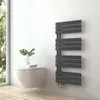 A modern bathroom with a wall-mounted toilet and a dark gray designer radiator. Podgląd zdjęcia produktu