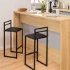 Two black bar stools are placed in front of a wooden kitchen counter. Voir les images du produit