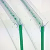Close-up view of two shower door seals attached to glass panels. Podgląd zdjęcia produktu