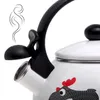 Close-up of a white whistling kettle with a black handle and a cartoon chicken design. Produktbild-Vorschau