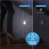 A split image showing a person's legs and feet on stairs on the left, and two panels on the right demonstrating a motion-activated LED night light. The left panel shows the light on, and the right panel shows it off with a timer icon and text indicating it Podgląd zdjęcia produktu