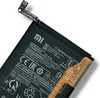 A black battery with a flexible circuit board connector, set against a white background. Produktbild-Vorschau