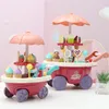 Two toy ice cream carts are displayed on a pink and white background. Produktbild-Vorschau