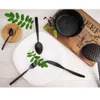A table setting with cutlery, a plate, and kitchenware. Náhled obrázku produktu