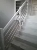 A staircase with a white handrail and silver balusters. Produktbild-Vorschau